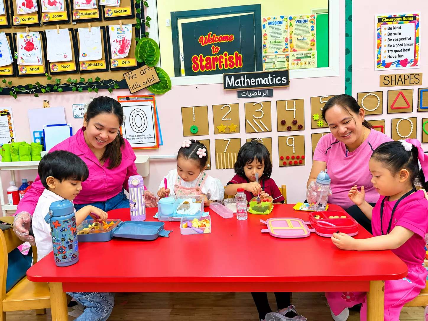 Children enjoying food time at nursery